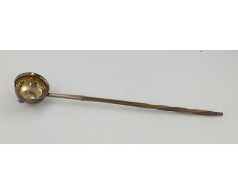 A GEORGIAN SILVER TODDY LADLE having bowl with spout and coin set base and whale bone handle 