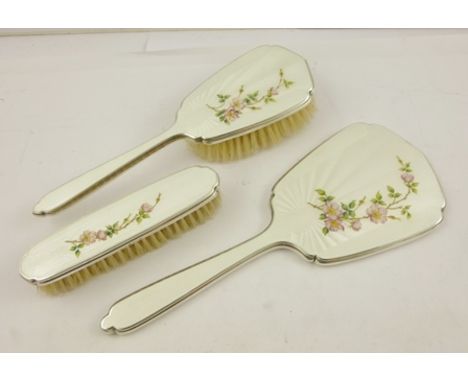 MAPPIN & WEBB A THREE PIECE SILVER DRESSING TABLE SET comprising; hand mirror, clothes brush and hair brush, each having engi