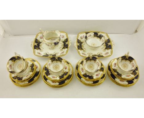 A 20TH CENTURY COALPORT PORCELAIN TEASET comprising milk slop, two bread and butter, nine cups, twelve saucers and eight tea 