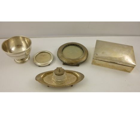 A SELECTION OF SILVER ITEMS comprising a plain un-engraved silver cigarette box, two photograph frames, a desk inkwell and a 