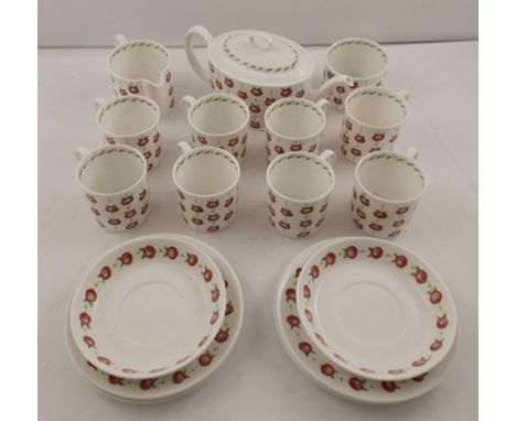 SUSIE COOPER A BONE CHINA TEASET in apple gay pattern comprising teapot, milk, sugar, eight cups, six tea plates and two sauc