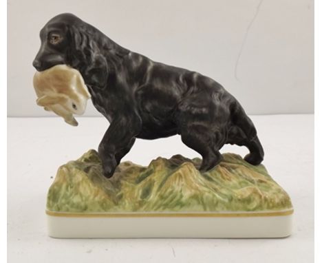 A ROYAL WORCESTER BONE CHINA MODEL COCKER SPANIEL in black with rabbit in mouth, 8cm high 