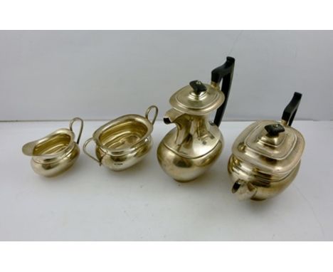 EDWARD VINER A FOUR PIECE SILVER TEASET of oblong bellied form, teapot and hot water with black fibre knops and handles, Shef