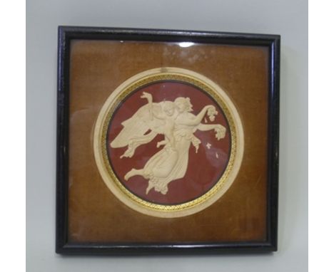 A 19TH CENTURY CAMEO EFFECT CERAMIC ROUNDEL, having classical figure decoration, in an ebonised glazed frame, 13cm diameter 
