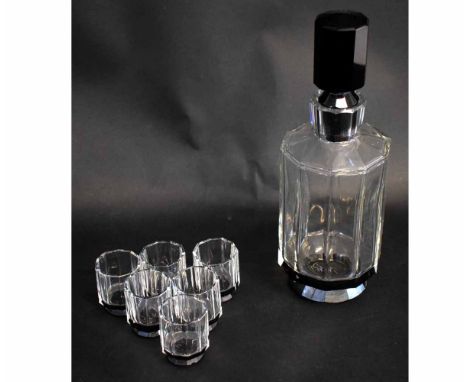 1930s French glass liqueur set, with a decanter with faceted body and a black stopper with six matching glasses  