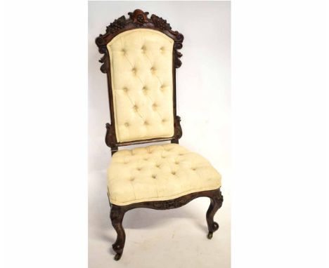 Victorian mahogany prie-deux chair with fruit carved top rail and cream upholstered and button seat and back, raised on cabri