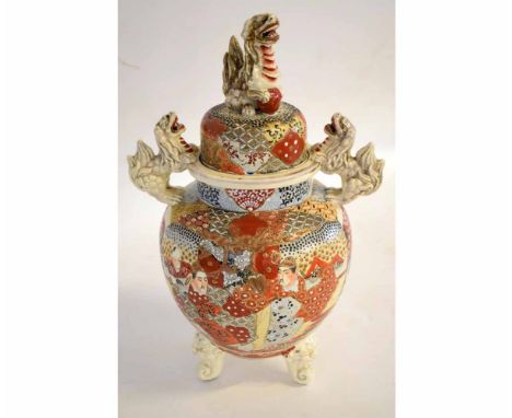 20th century Satsuma Koro style vase with figural decoration with Fo dog handles and finial, raised on three shaped feet, 42c