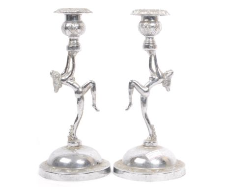 A pair of Art Deco circa 1940s nude lady dancing candle stick holders. With foliate design to top with a circular dome base. 