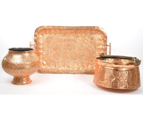 A collection of Middle Eastern / Indian copper items. Hammered twin handled tray with geometric pattern throughout. Together 