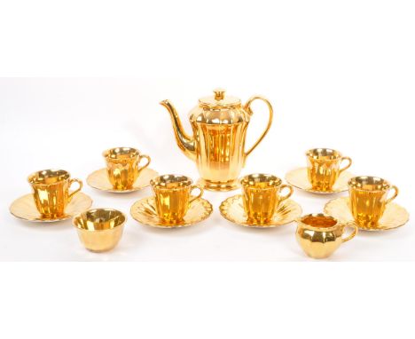 A complete vintage 20th century 'Wade Gold' porcelain tea / coffee service in a gold ground colourway.&nbsp; The service comp