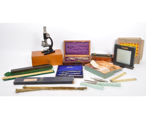 A collection of vintage 20th century measuring rules, engineering cased instruments and tools. To include, optician equipment