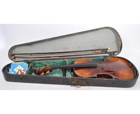 A 19th century string musical instrument violin. Having two bows, f holes and wooden turn pegs. Measures 60cm long. No label 