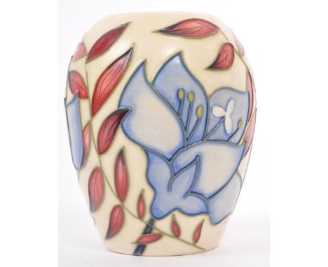 A contemporary circa 2004 Moorcroft vase, in the Jacob's Ladder pattern by Alicia Amison. Having a cream base and foliate des
