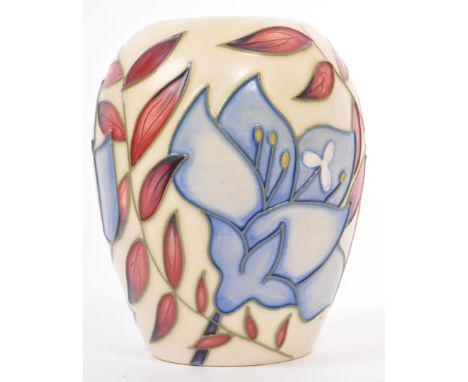 A contemporary circa 2004 Moorcroft vase, in the Jacob's Ladder pattern by Alicia Amison. Having a cream base and foliate des