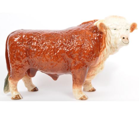 Melba ware for H. A. Wain &amp; Sons Ltd. A vintage 20th century pottery ceramic bull animal figurine. In a standing position