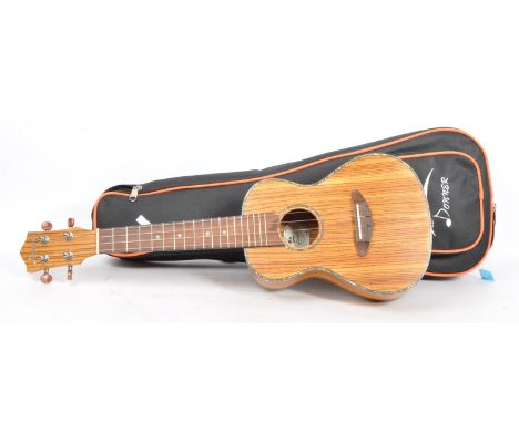 A 20th Century&nbsp;classic ukulele with inlaid pearlescent borderline edging to front &amp; reverse. Marked Donner to headst
