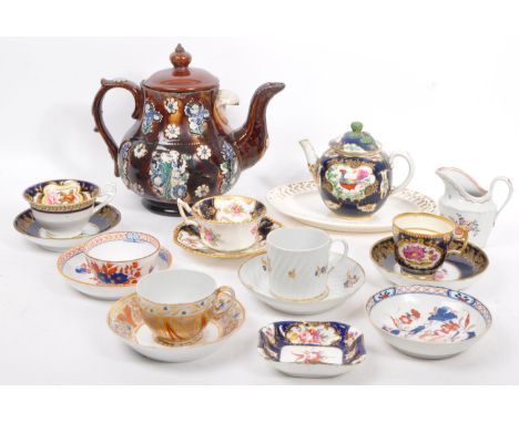 A collection of 19th century and later hand painted porcelain ceramic cups, saucers, jugs, pierced plate and teapots. Lot to 