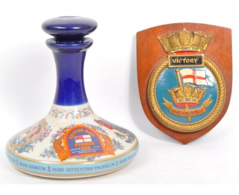 British Navy - Pusser's Rum. A vintage 20th century maritime British Royal Navy porcelain china decanter of rum (empty). Manu