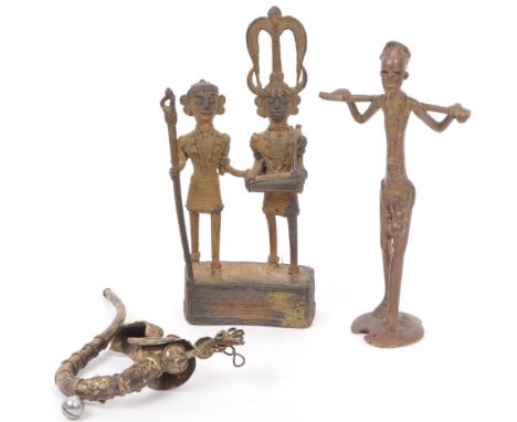 A collection of 20th century middle eastern figurines. Comprising of a tribal African couple in traditional attire with headd