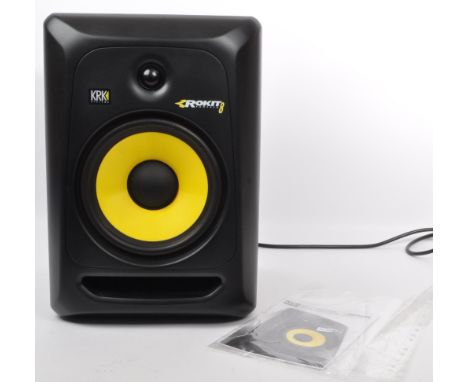 A contemporary 'Rokit Powered 6' studio reference monitor speaker by 'KRK'. With power cable and instruction booklet.  Measur