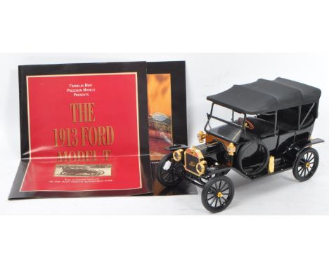 Franklin Mint - A 1:16 scale 1913 Ford Model T. Comes in its original polystyrene packaging, outer box, care instructions and