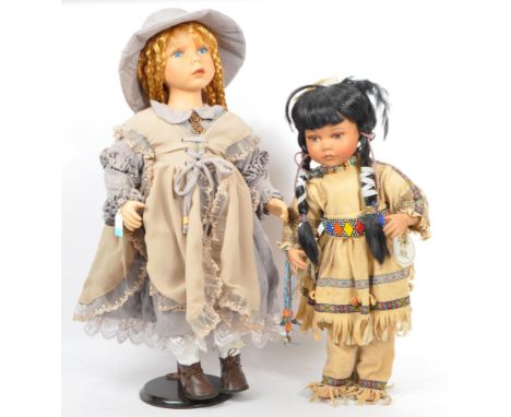 A pair of mid to late 20th Century bisque headed dolls with wood stands. The largest by Alberon Dolls named 'Grace, the other