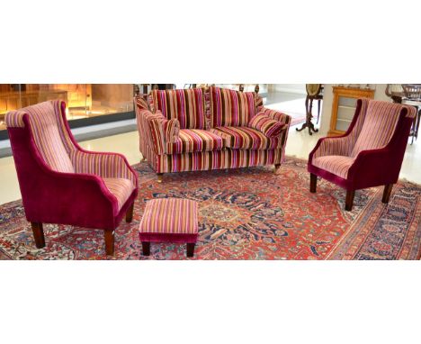 Five piece suite in multi-stripped fabric comprising a pair of knoll sofas, two wing back chairs and a foot stool (all en sui