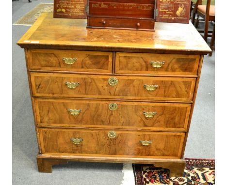 An 18th century walnut and pearwood banded chest of drawers, with a moulded top over two short and three long drawers, on bra