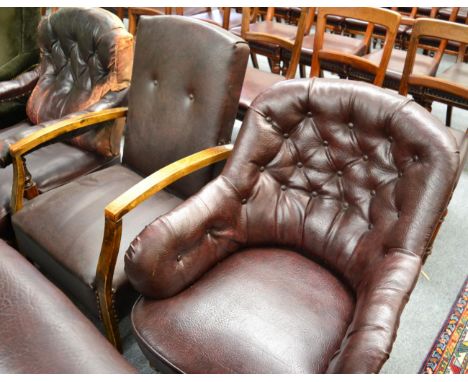 ~ A late Victorian armchair recovered in button back leather raised on turned legs, together with a 1930s armchair upholstere
