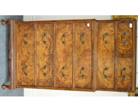 = A 1930's walnut seven drawer straight fronted chest