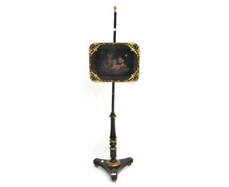 A Regency ebonised pole screen