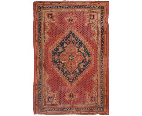 Ushak carpet, West/Central Anatolia, the soft raspberry field of stylised flowerheads around an indigo hexagonal medallion fr