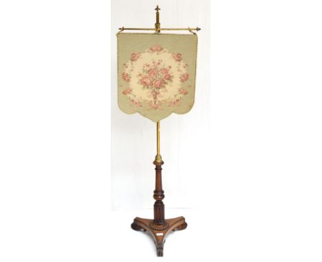 A George IV mahogany pole screen with floral needlework banner
