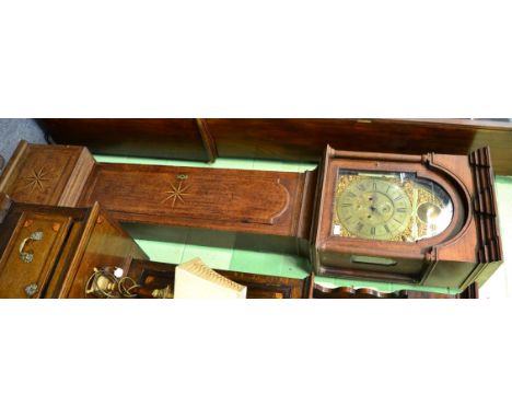 An oak eight day longcase clock, flat top pediment, inlaid borders, arched brass dial with a seconds dial and date aperture, 