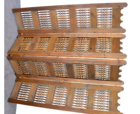A decorative four leaf hardwood screen 