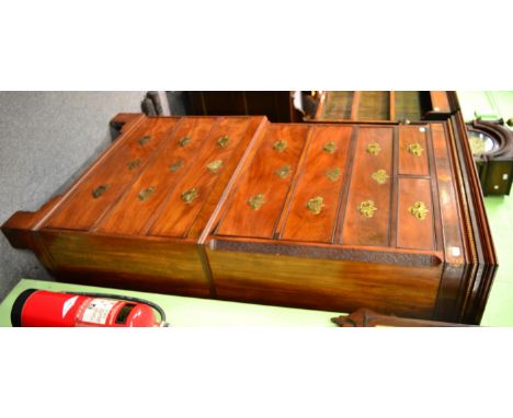 A George III mahogany and oak lined chest on chest, circa 1800, the bold cornice above a parquetry decorated frieze and inlai