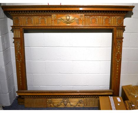 # A George III carved pine and gesso fireplace mantel, early 19th century, in Adam style, with egg and dart shelf above a den