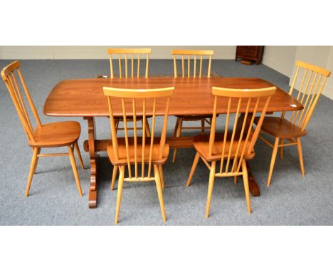 An Ercol suite comprising six Ercol chairs, an Ercol sideboard and an Ercol table 