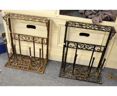 = A pair of cast iron boot racks/scrapers and a brass hook scale