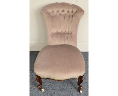 A late Victorian nursing chair, later upholstered in green button back velvet 