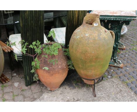 Terracotta Amphora on metal stand and another 