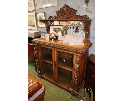 Heavily carved 19thC Oak mirror backed chiffonier with vine and figural decoration 