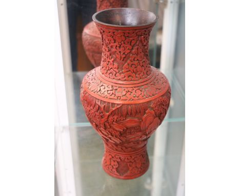 Chinese Cinnabar Lacquer Vase with Rocky outcrop and Foliate decoration. 25cm in Height 