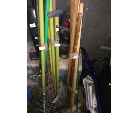A bundle of brushes and 2 bundles of garden tools. 