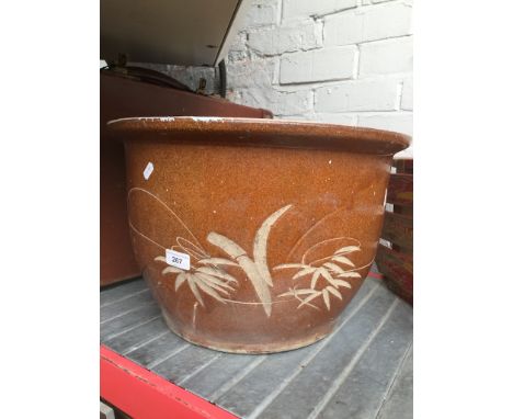 A large pottery planter. 