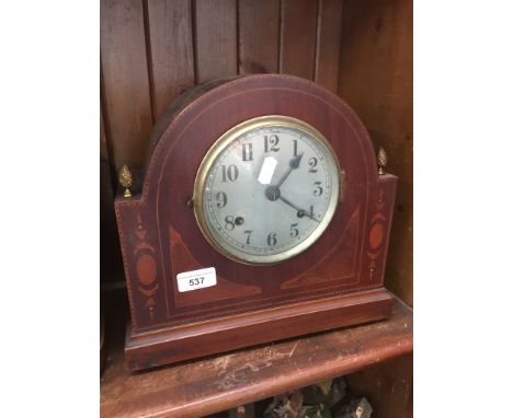 An inlaid mantle clock 