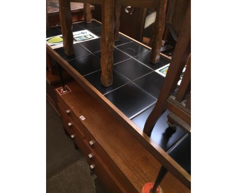 A retro mid 20th century tile top coffee table on tapered legs by Mesita Furniture.Condition: light surface scratches with a 