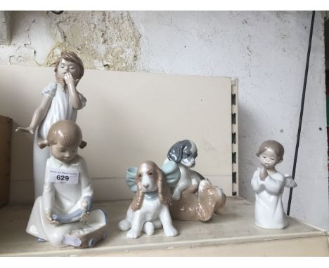 Four Nao figures and one Lladro figure 