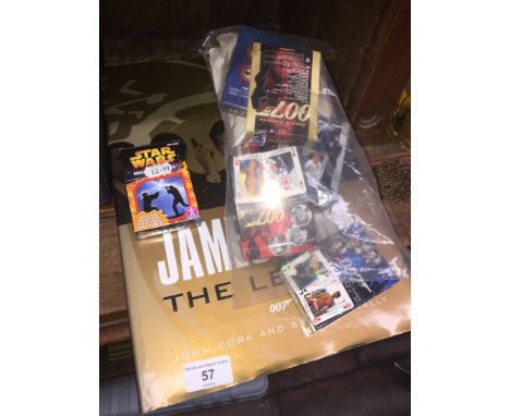A collection of playing cards to include 007 Bond, related book, etc. 