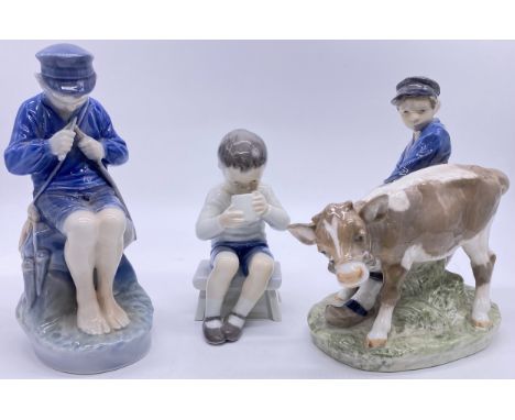 Three Royal Copenhagen figures; boy and calf, young boy whittling a stick and young boy drinking from cup